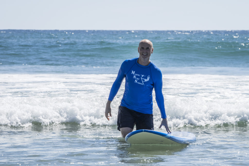 Chip Conley surfing
