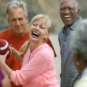 healthy aging group playing football